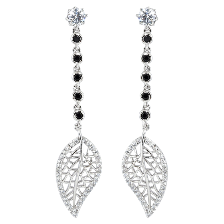 Серьги Xuping Родий пусеты Резные листики на дорожке черного циркония фото №1 Серьги Xuping Родий пусеты Резные листики на дорожке черного циркония фото №1