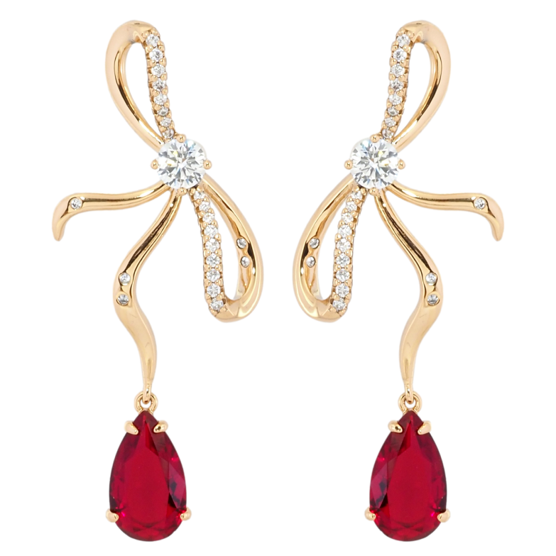 Серьги Xuping Позолота 18K пусеты Банты с красными фианитами фото №3 Серьги Xuping Позолота 18K пусеты Банты с красными фианитами фото №3