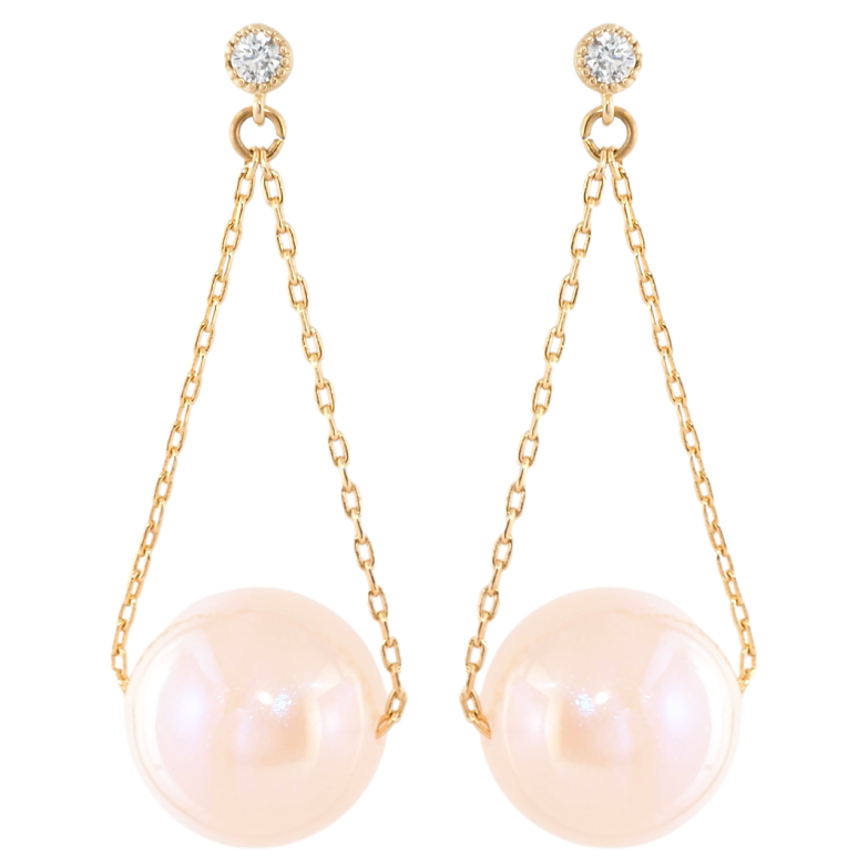 Серьги Xuping Позолота 18K пусеты Розовые шарики на цепочке фото №1 Серьги Xuping Позолота 18K пусеты Розовые шарики на цепочке фото №1