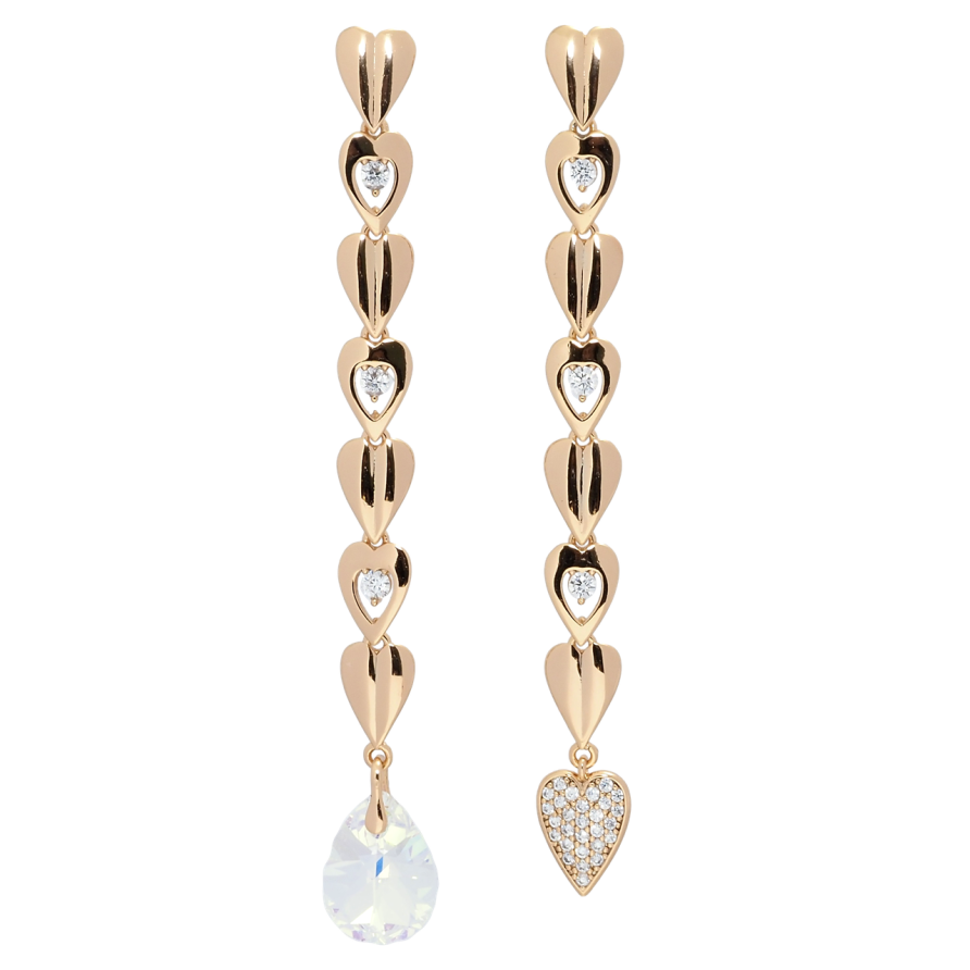 Серьги Xuping цвет 18K с кристаллами Swarovski пусеты Ассиметричные сердечки с кристаллом Shimmer фото №1 Серьги Xuping цвет 18K с кристаллами Swarovski пусеты Ассиметричные сердечки с кристаллом Shimmer фото №1
